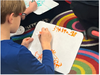 Student adding numbers to 100 using a number line hop